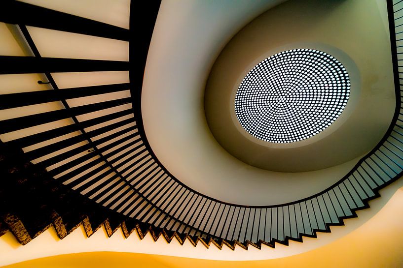 Yellow spiral staircase by Maerten Prins