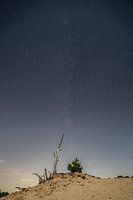 Milky Way in the starry sky at a moonscape landscape