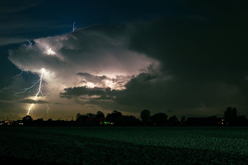Branched off lightning strikes outside the thunderstorm by Menno van der Haven