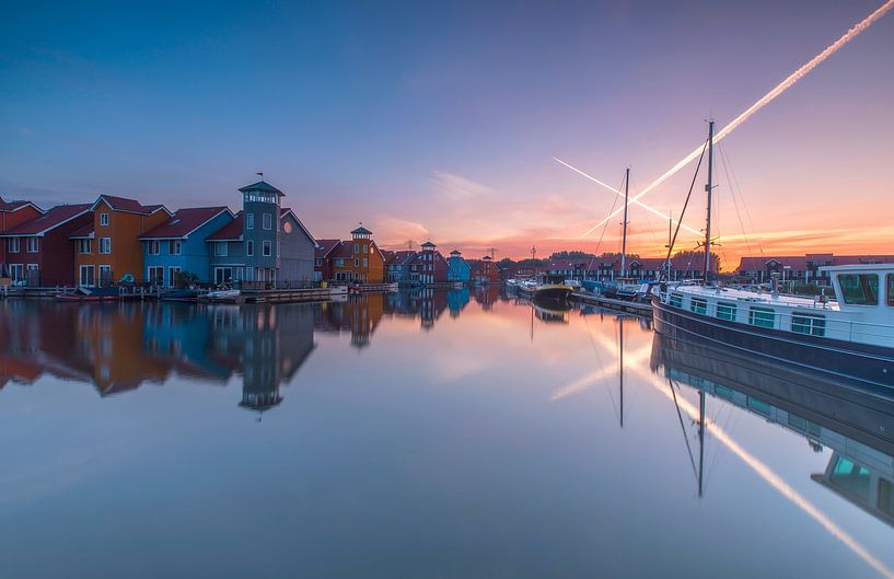 Colored houses at sunrise by Marcel Kerdijk