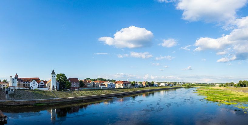 Lithuania, Panorama reflecting buildings of Kaunas City in water of river by adventure-photos