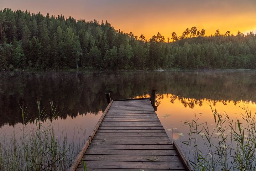 Scaffolding on mirror smooth lake. by Axel Weidner