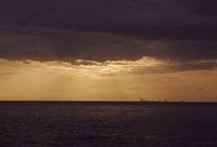 Heavenly light through clouds at sea