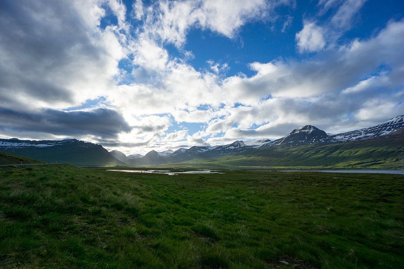 Iceland - Magical landscape green meadows between snowy mountain by adventure-photos