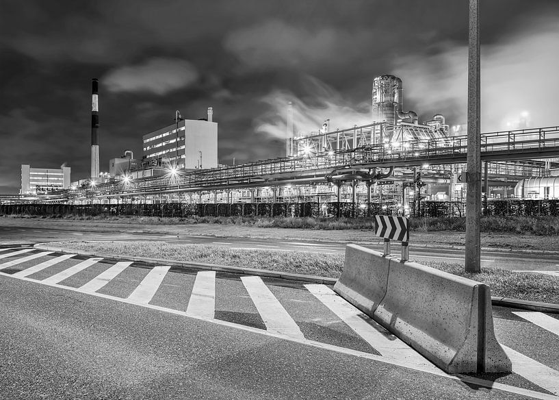 Petrochemical production plant at night with road block, Belgium by Tony Vingerhoets