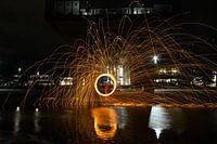 Lightpainting with steel wool reflected in the water