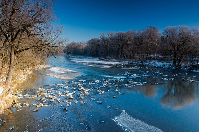 Shallow spot of the river Isar in Munich with ice on rocks on a  by Robert Ruidl