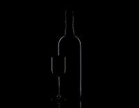 Bottle and glass low-key