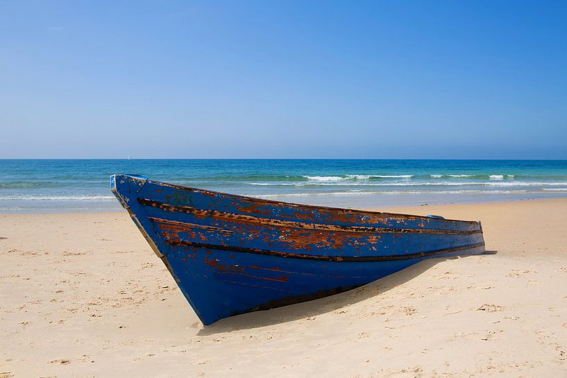 Rowing boat on the beach by Frank Herrmann
