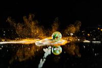 Op spattende knikker