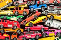 Stack of colourful toy cars