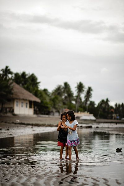 Children in fishing village in Philippines by Yvette Baur