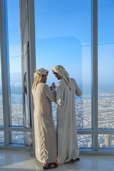 Two Arabian man in the Burj Khalifa in Dubai by Jeroen Kleiberg