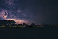 Lightning in purple sky.