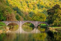 Idyllic bridge in autumn landscape