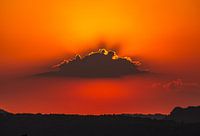 Sunset behind a cloud