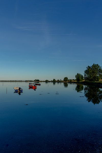 Travel photography - calm sea with boats at dusk by Ben De Kock