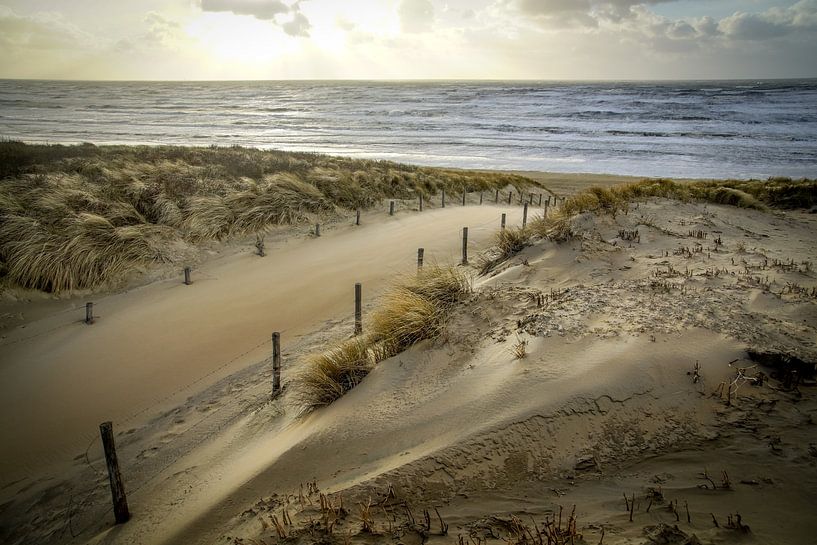Beach, sea and sun on a stormy evening! by Dirk van Egmond
