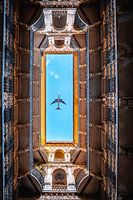 View upwards with airplane , Budapest courtyard