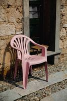 Real Life Still life of pink plastic chair