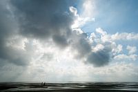 Wolken over het wad