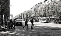 Parisian pedestrians crossing the Avenue des Champs-Élysées.