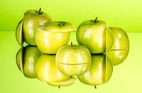 Reflected green apples