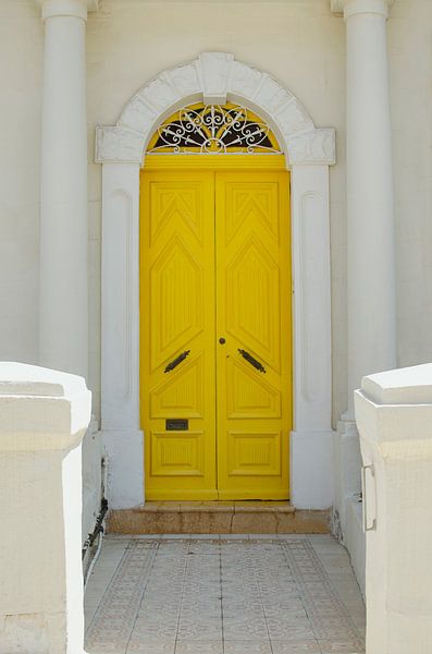 Yellow door in Sliema, Malta by Carolina Reina Photography