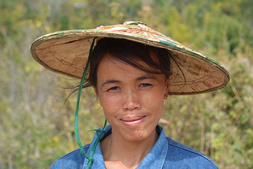 Portrait of friendly lady with straw hat in rural Myanmar by My Footprints