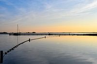 Coucher de soleil derrière la jetée du lac Veere