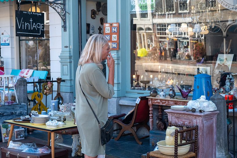 Woman with cigarette for antique shop by Helene van Rijn