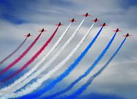 the jets of the Red Arrows with red, white and blue smoke
