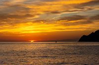 Fisherman heads home during sunset