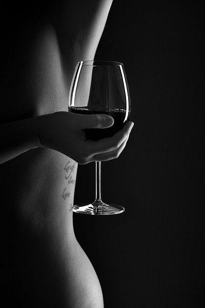 Woman body lines with a glas of wine in black and white by Leo van Valkenburg
