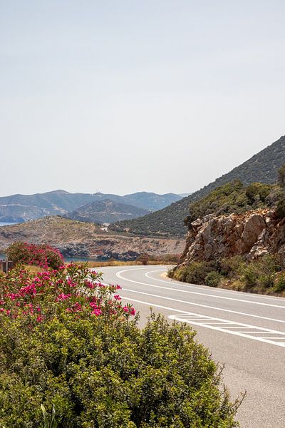 The road along Crete's north coast with mountains | Travel photography by Kelsey van den Bosch