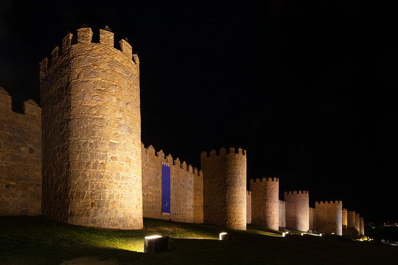 Medieval city wall around center of Avila, Spain by night by Joost Adriaanse