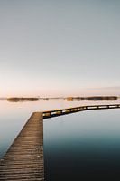 Boardwalk over water at sunset