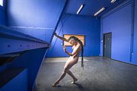 Female art nude in the blue room