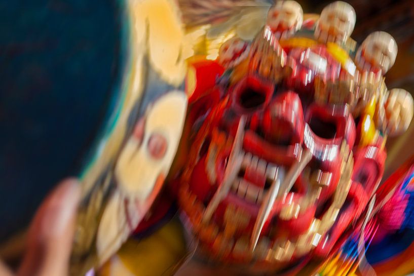 Dynamic display of red mask during dance festival in Bhutan by Wout Kok