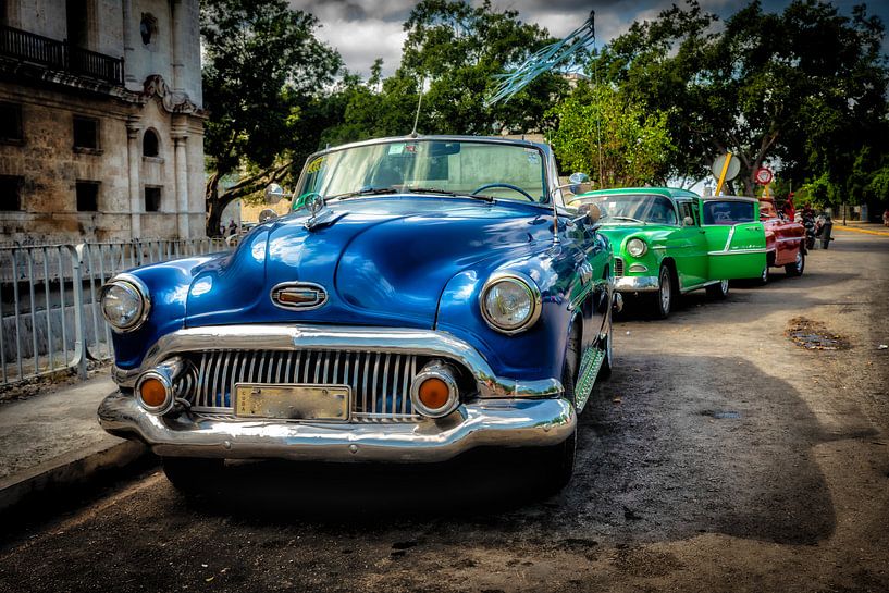 Oldtimer vintage cars convertible in street of the old town of Havana Cuba by Dieter Walther