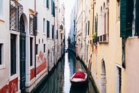 Red accents in a narrow canal