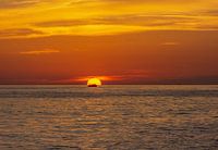 Fisherman heads home during sunset