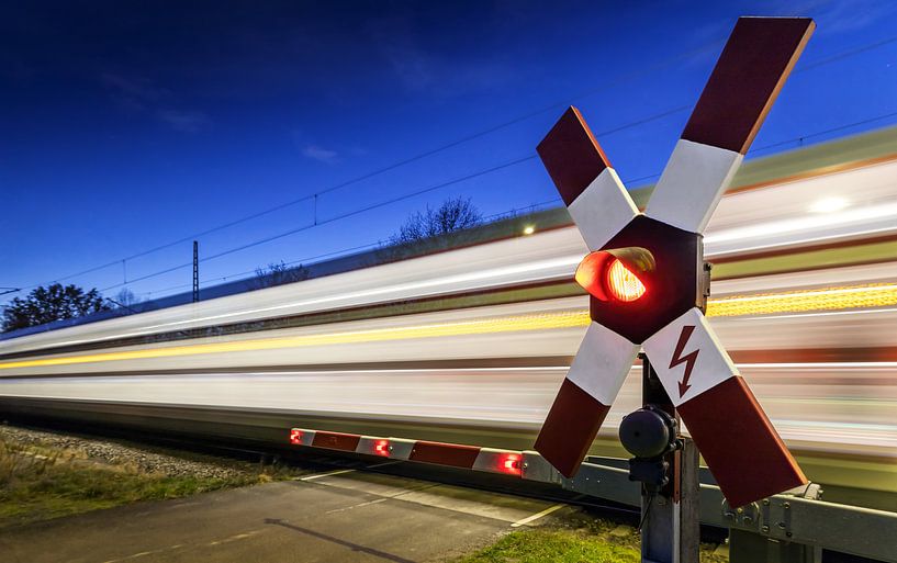 Level crossing with passing train by Frank Herrmann
