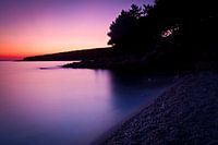 Rust aan zee na zonsondergang