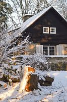 Vacation home in the Ardennes in a winter landscape.