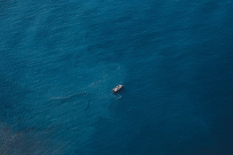 Boat at sea on Madeira coast by Erwin van Kester