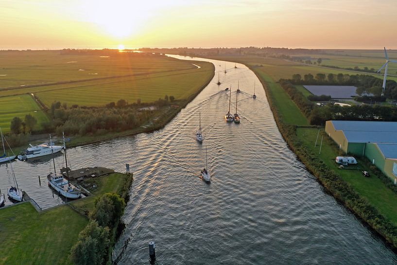 Aerial photo of sailing boats in the frieze landscape at sunset by Eye on You