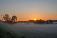 Old road bridge in the fog