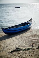 Abandoned fishing boat on beach in Portugal