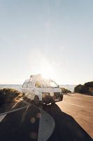 A motorhome parked along the coast at sunset in Australia